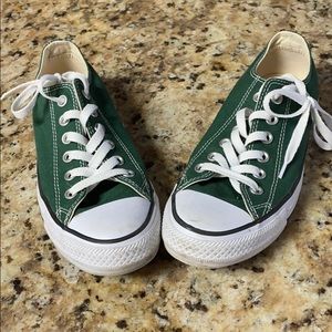 Dark green Converse, slightly worn